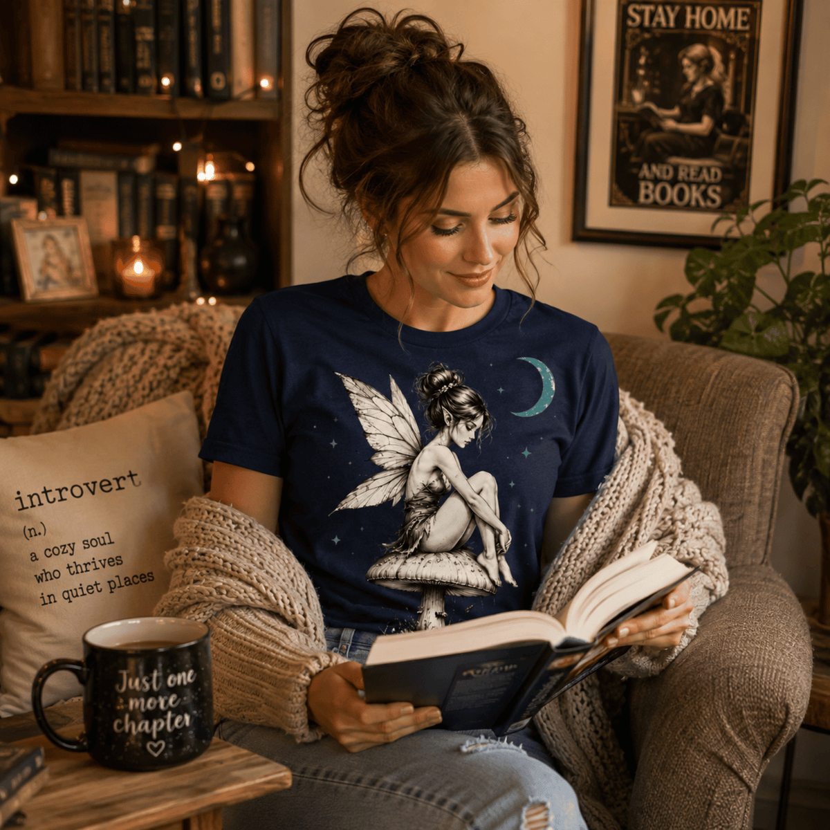 Woman in living room wearing Mushroom Fairy graphic t-shirt and reading a book.