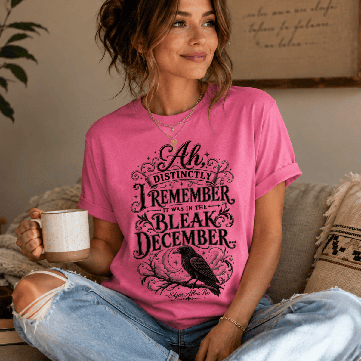 A woman wearing a charity pink Bleak December book quote graphic t-shirt.