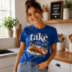 A woman wearing a true royal Cannoli funny food graphic t-shirt in a kitchen.