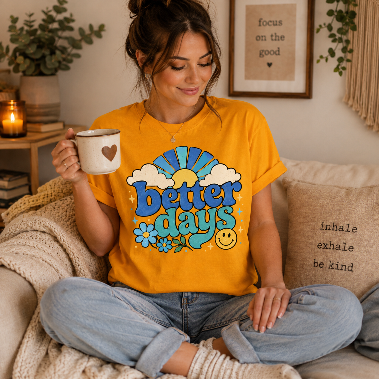 A woman wearing a gold Better Days inspirational introvert graphic t-shirt drinking coffee.
