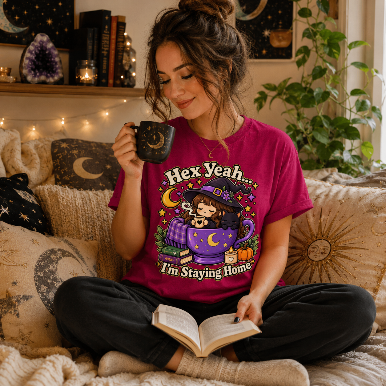 A woman wearing a berry Hex Yeah cute witchy graphic t-shirt drinking coffee.