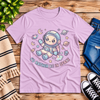 Floating In Space funny introvert graphic t-shirt cozy flat lay in lilac.