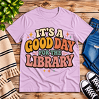 It's A Good Day book lovers graphic t-shirt cozy flat lay in lilac.