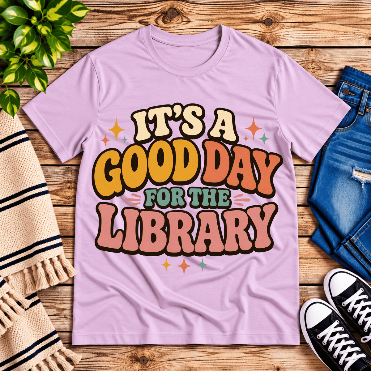 It's A Good Day book lovers graphic t-shirt cozy flat lay in lilac.