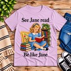 See Jane Read vintage book graphic t-shirt cozy flat lay in lilac.