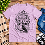 Bleak December book quote graphic t-shirt cozy flat lay in lilac.