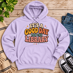 It's A Good Day cute book graphic hoodie cozy flat lay in lilac.