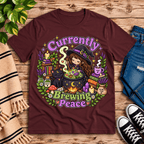 Currently Brewing cute witchy graphic t-shirt cozy flat lay in maroon.
