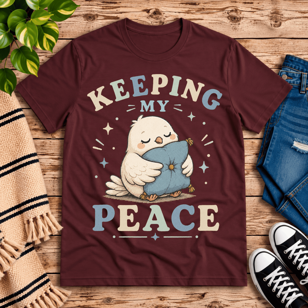 Keeping My Peace cute animal graphic t-shirt cozy flat lay in maroon.
