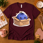 Blueberry Box cute food graphic t-shirt in cozy flat lay in maroon.