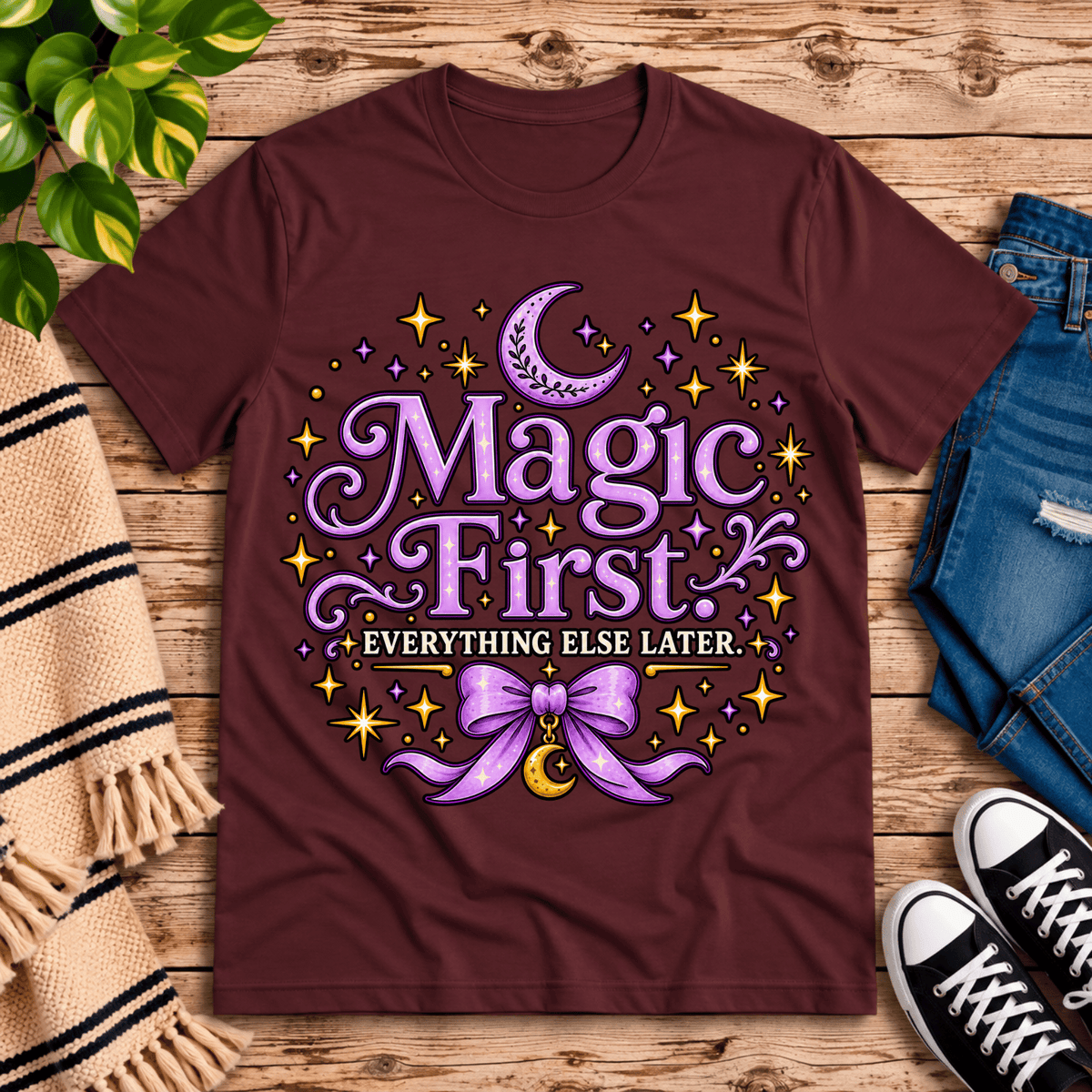 Magic First cute celestial graphic t-shirt cozy flat lay in maroon.