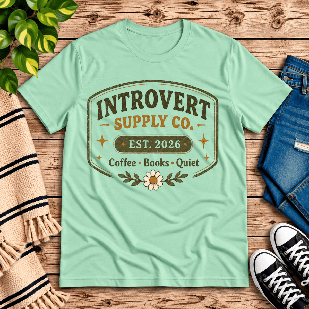 Introvert Supply Co. cute introvert graphic t-shirt cozy flat lay in mint.