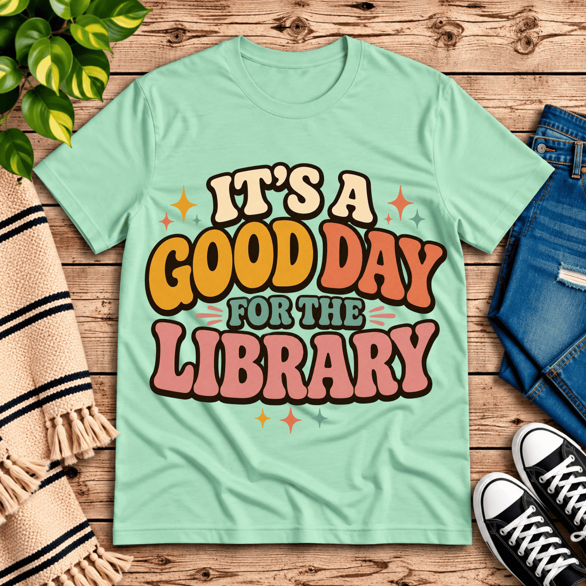 It's A Good Day book lovers graphic t-shirt cozy flat lay in mint.