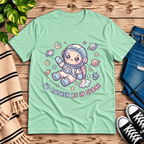 Floating In Space funny introvert graphic t-shirt cozy flat lay in mint.