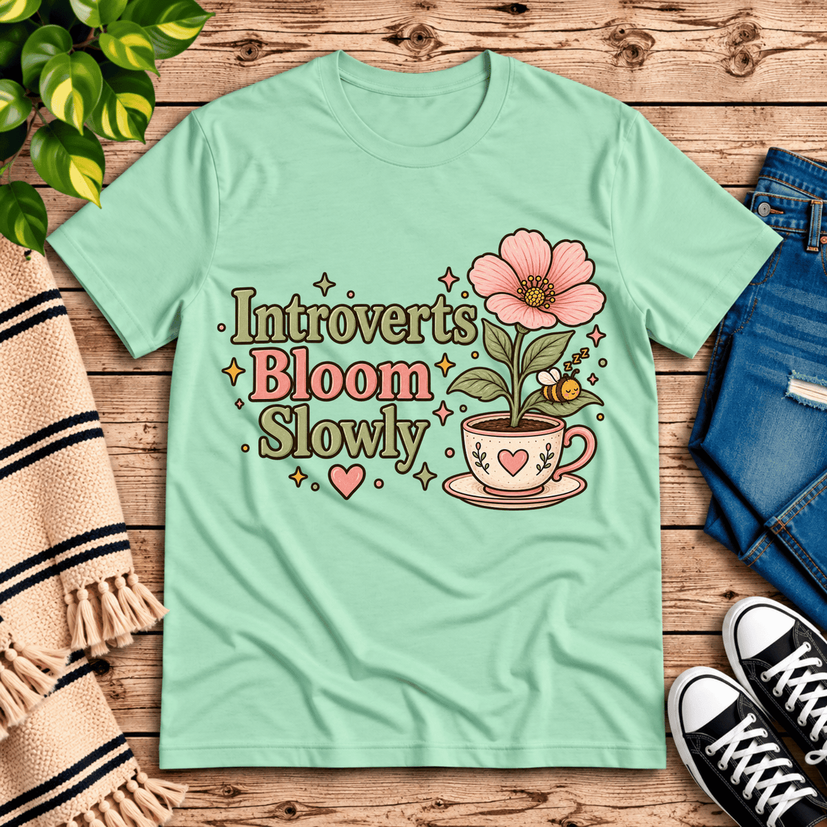 Introverts Bloom Slowly cute plant graphic t-shirt cozy flat lay in mint.