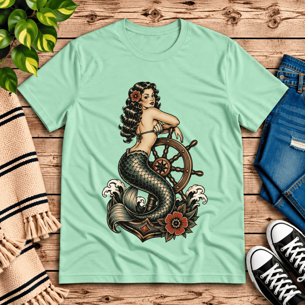 Ship Wheel Mermaid vintage pinup graphic t-shirt cozy flat lay in mint.