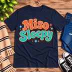 Miso Sleepy funny food graphic t-shirt cozy flat lay in navy.