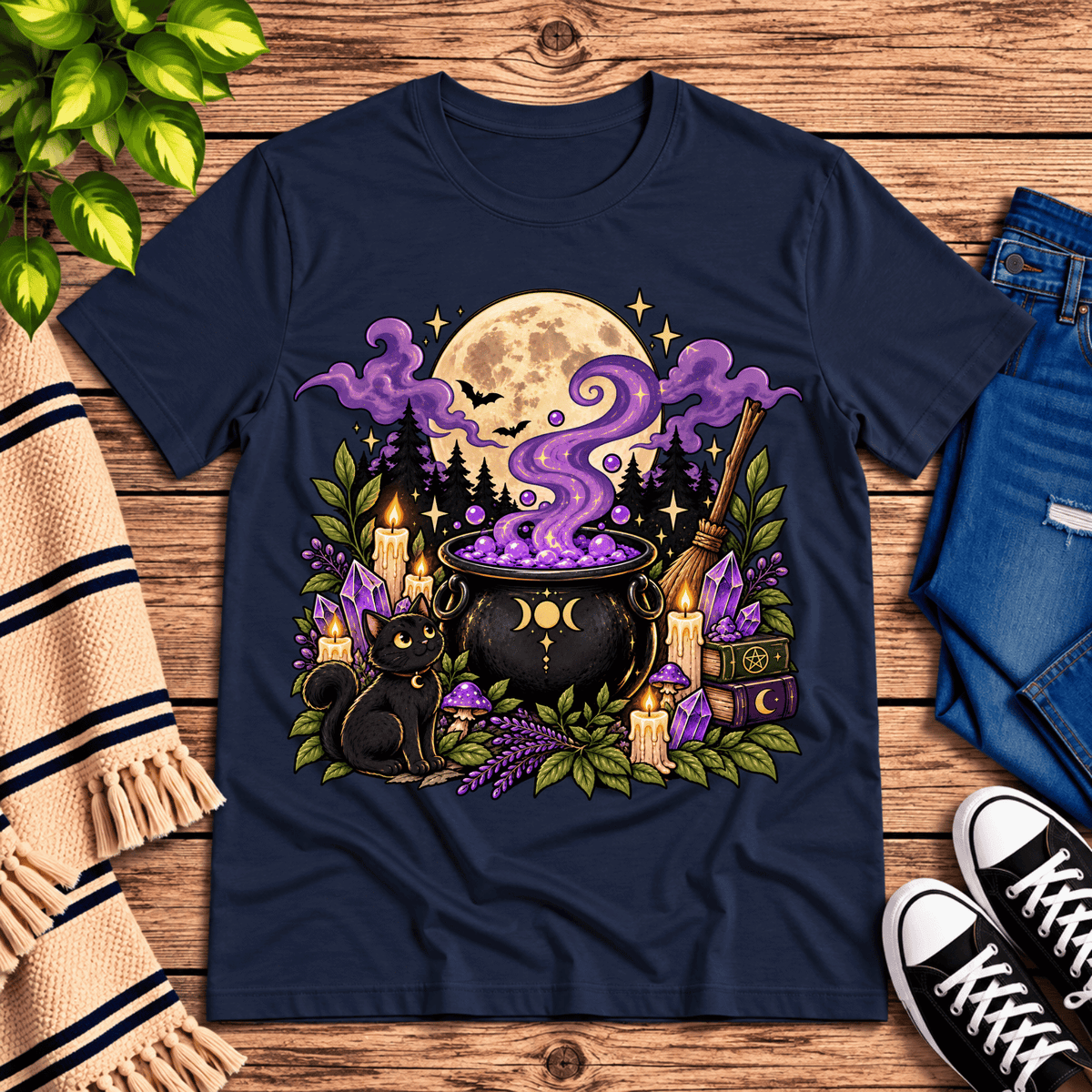 The cauldron cute celestial graphic t-shirt cozy flat lay in navy.
