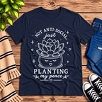Planting My Peace cute plant graphic t-shirt cozy flat lay in navy.