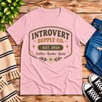 Introvert Supply Co. cute introvert graphic t-shirt cozy flat lay in pink.