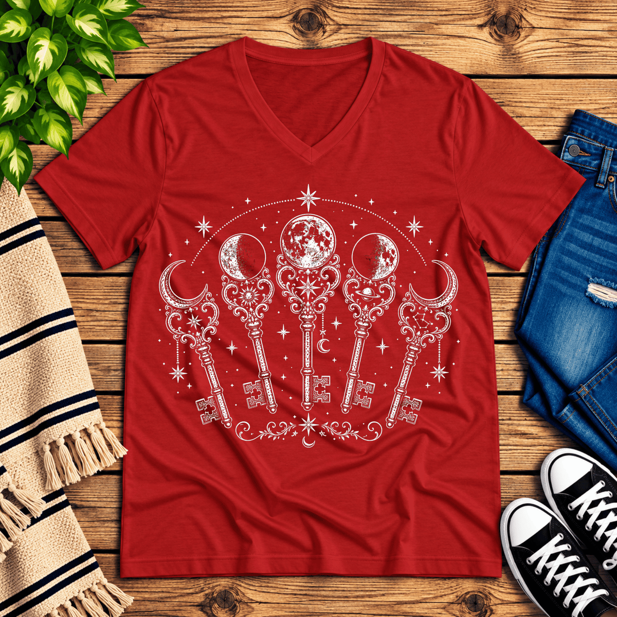 Moon Phase Keys celestial v-neck graphic t-shirt cozy flat lay in red.