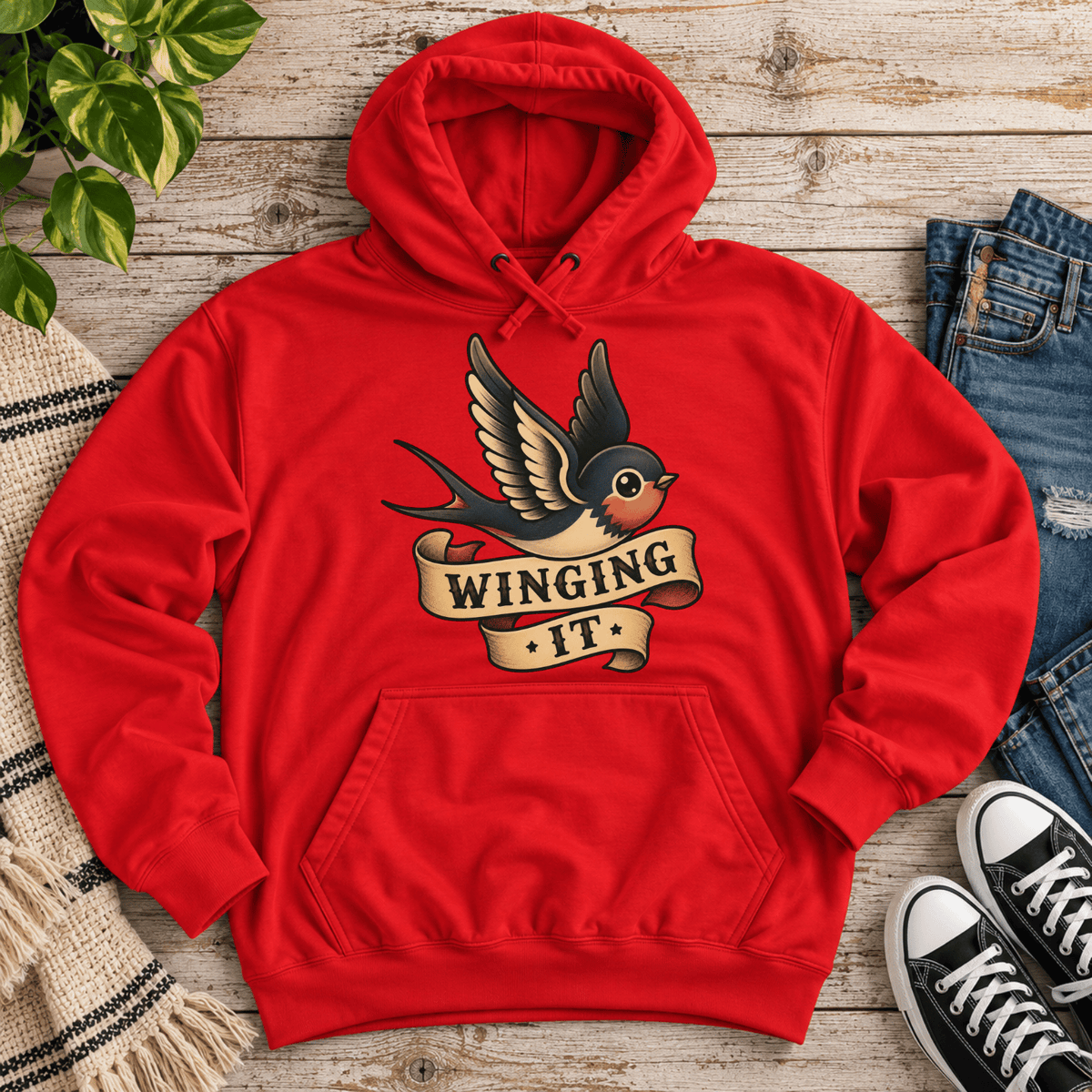 Winging It cute animal graphic hoodie cozy flat lay in red.