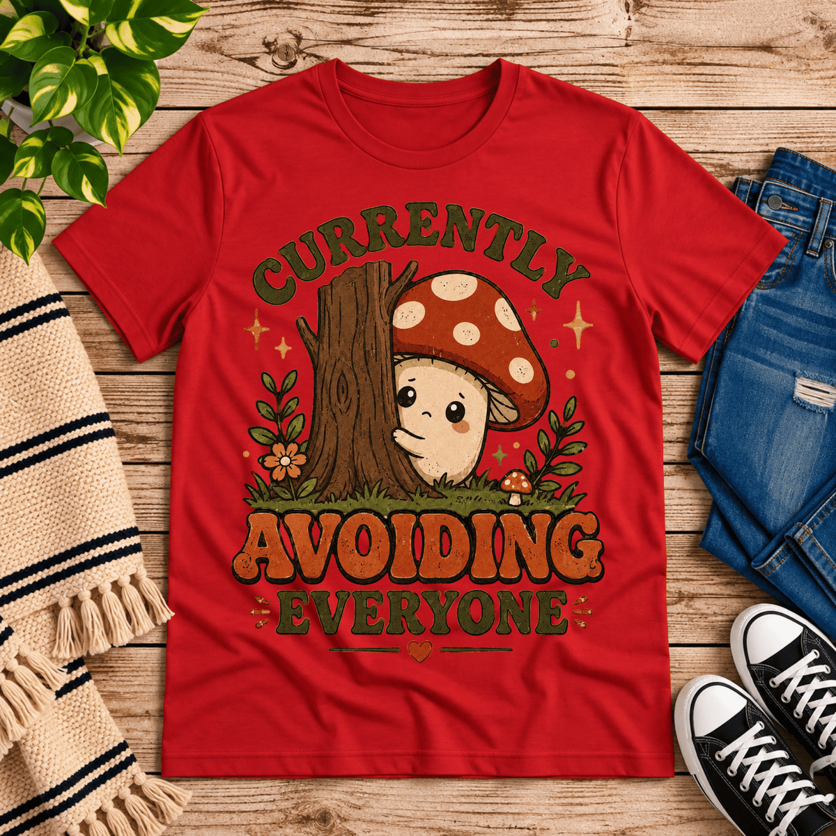 Currently Avoiding funny cottagecore graphic t-shirt cozy flat lay in red.