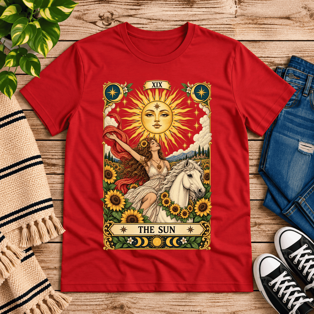 The Sun tarot card mystical graphic t-shirt cozy flat lay in red.