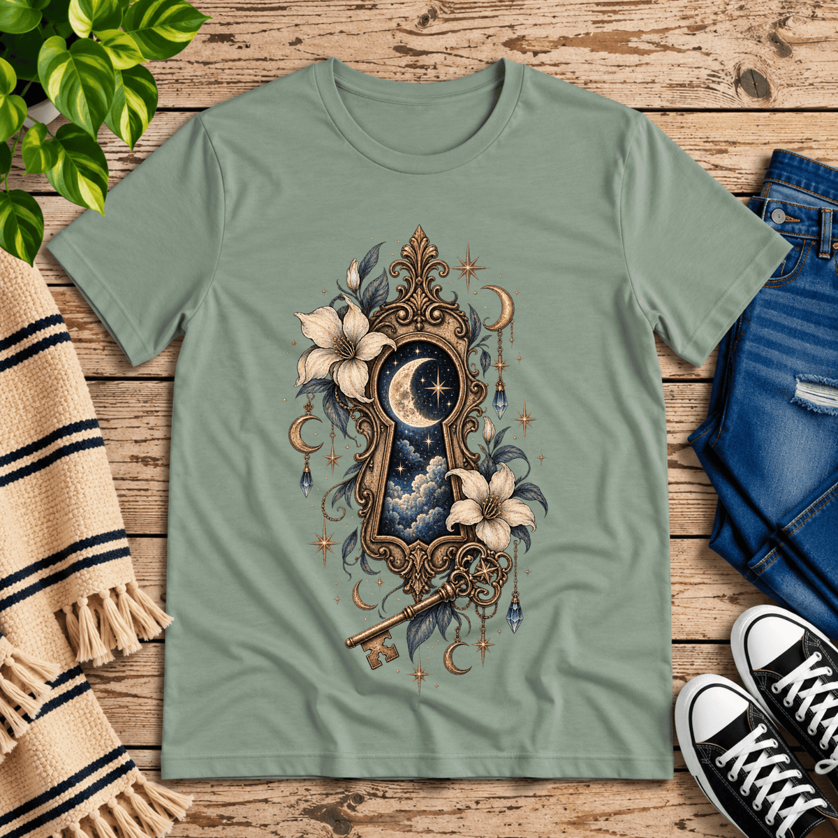 Cosmos Keyhole celestial graphic t-shirt cozy flat lay in sage.