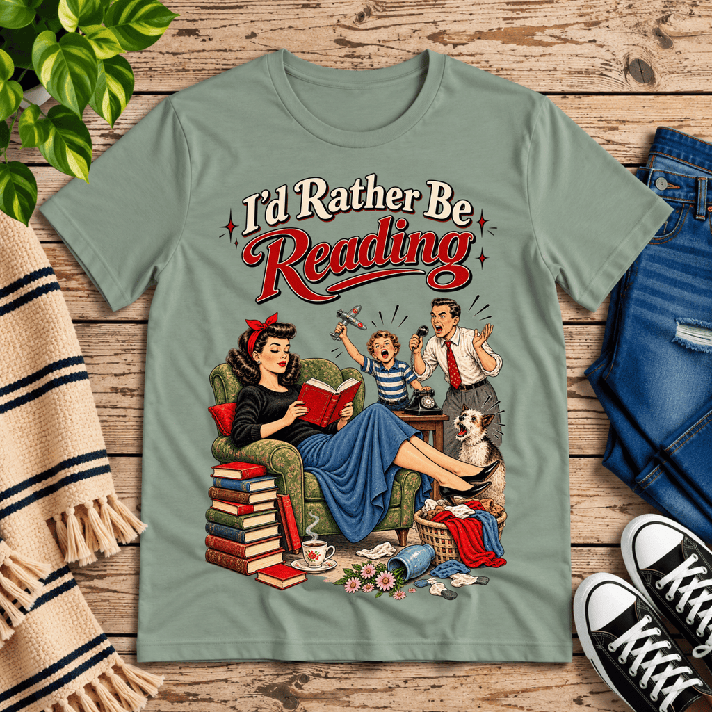 A cozy flat lay mockup of I'd Rather Be retro book graphic t-shirt in sage.