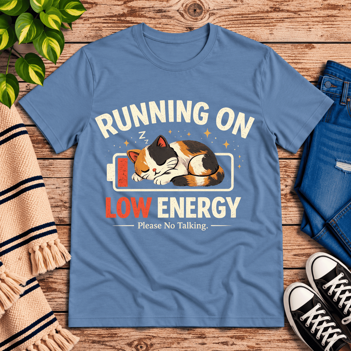 Low Energy Cat cute animal graphic t-shirt cozy flat lay in steel blue.