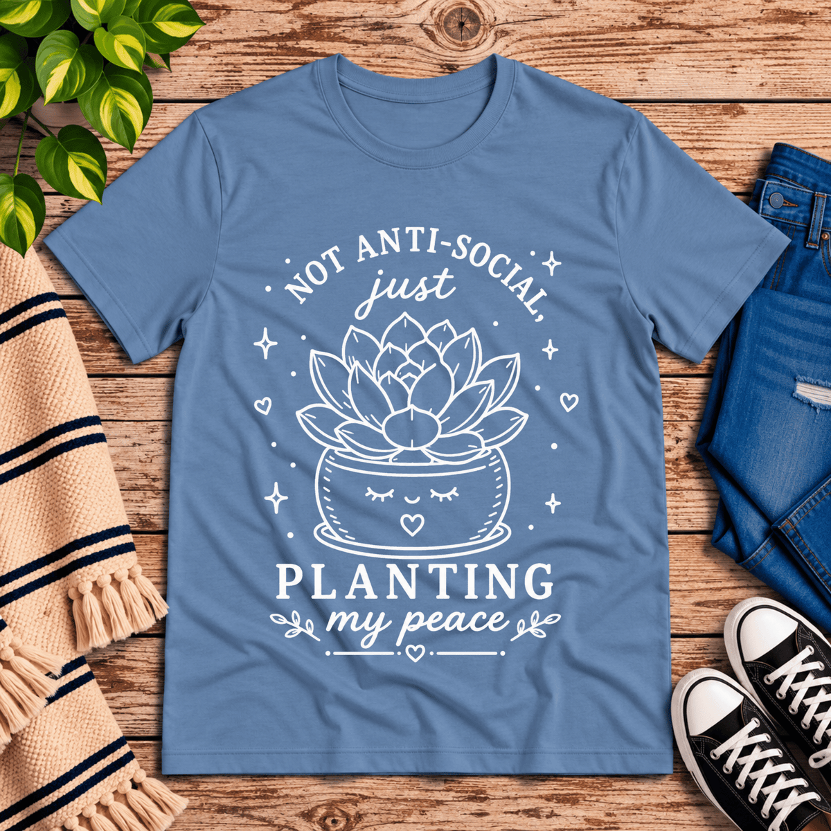 Planting My Peace cute plant graphic t-shirt cozy flat lay in steel blue.