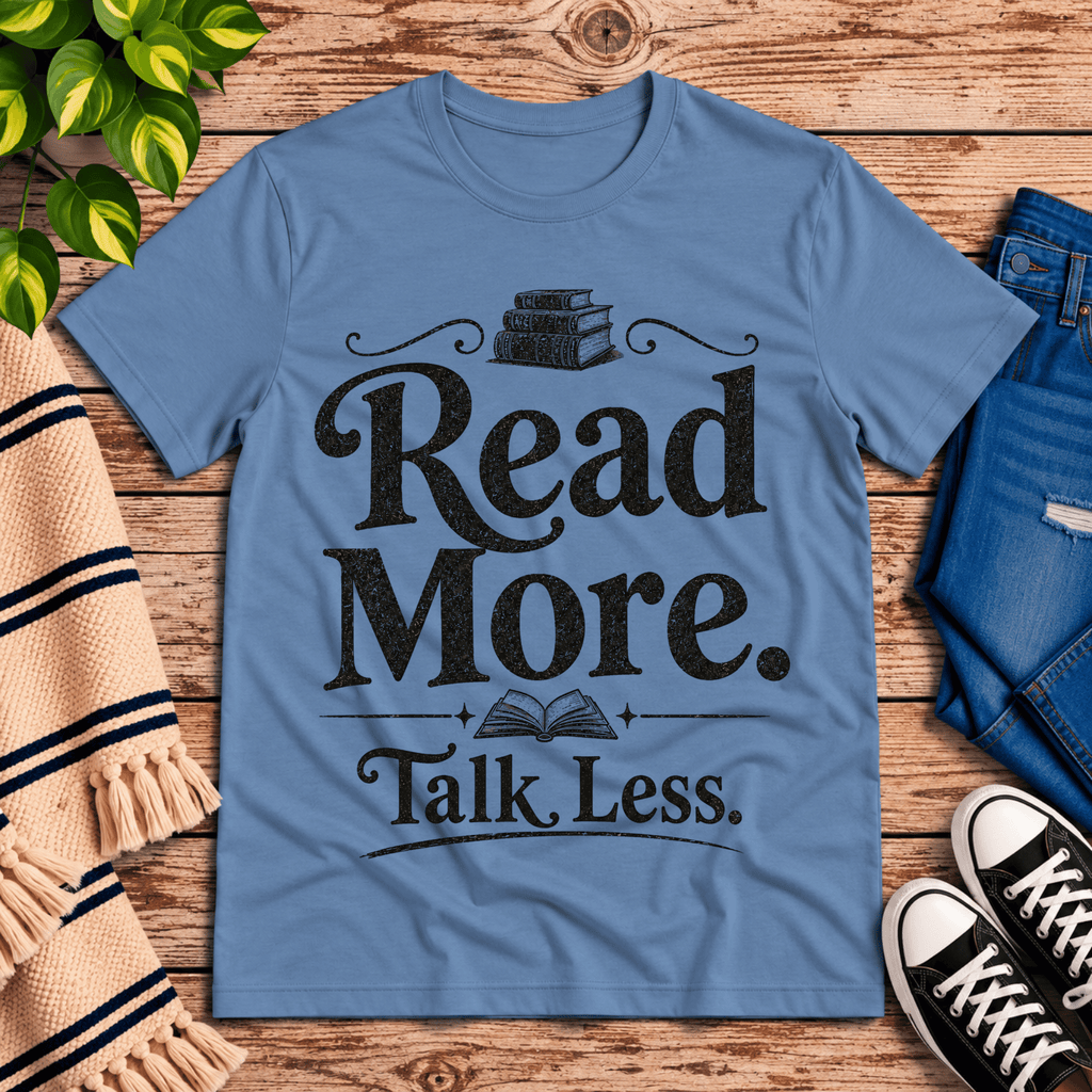 Talk Less funny book graphic t-shirt cozy flat lay in steel blue.