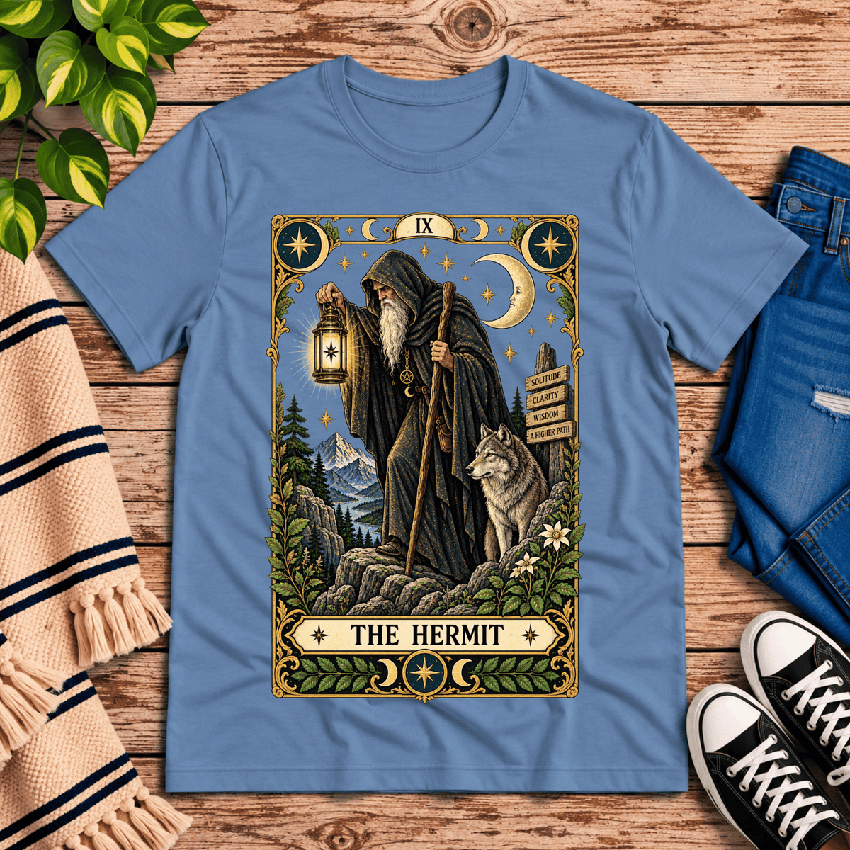 The Hermit tarot card graphic t-shirt cozy flat lay in steel blue.