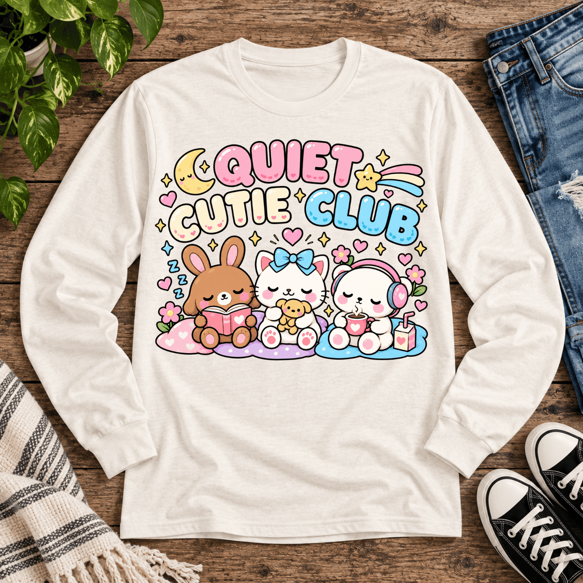 Quiet Cutie Club introvert graphic long sleeve cozy flat lay in sweet cream heather.