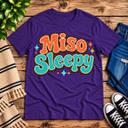 Miso Sleepy funny food graphic t-shirt cozy flat lay in team purple.