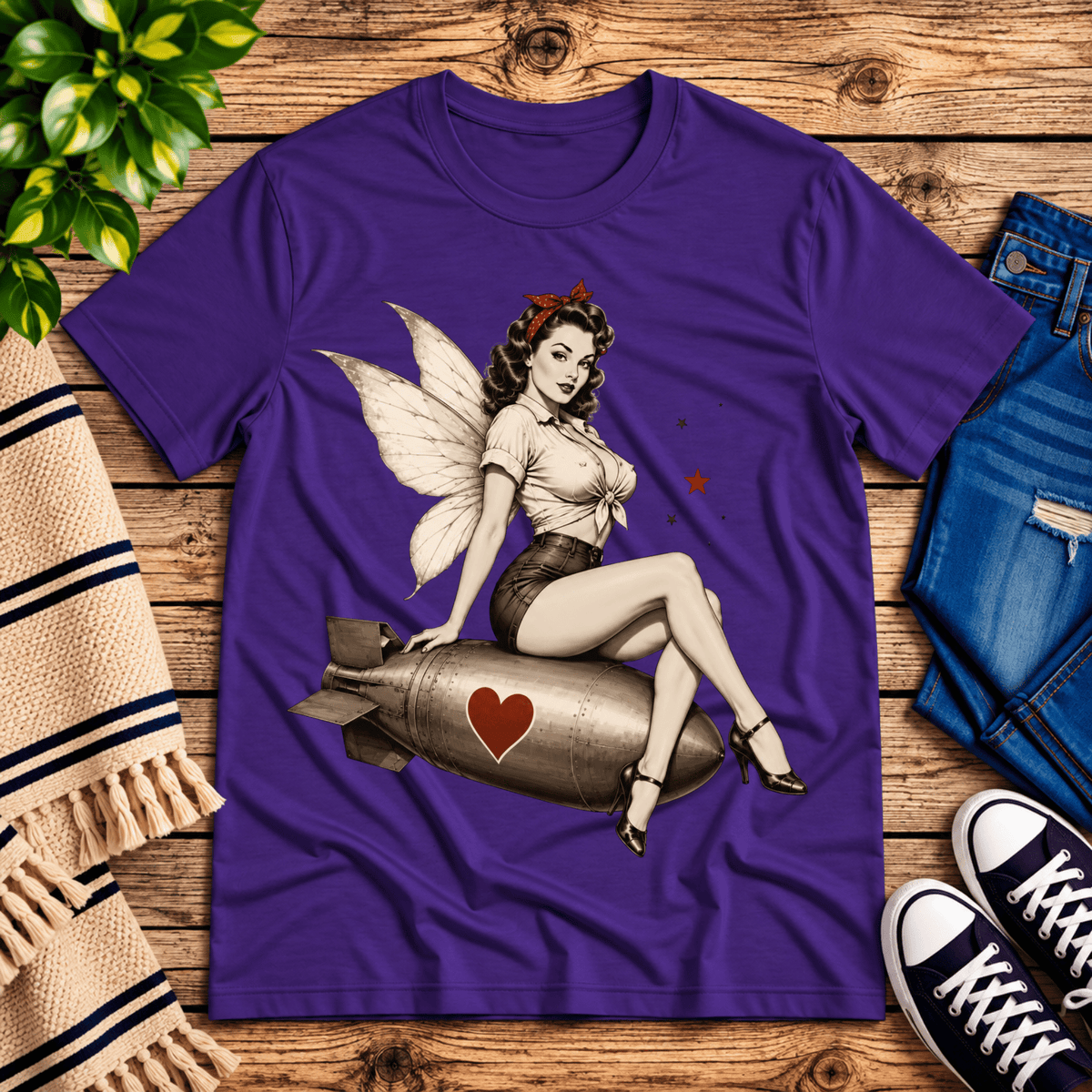 Love Bomb vintage pinup graphic t-shirt cozy flat lay in team purple.