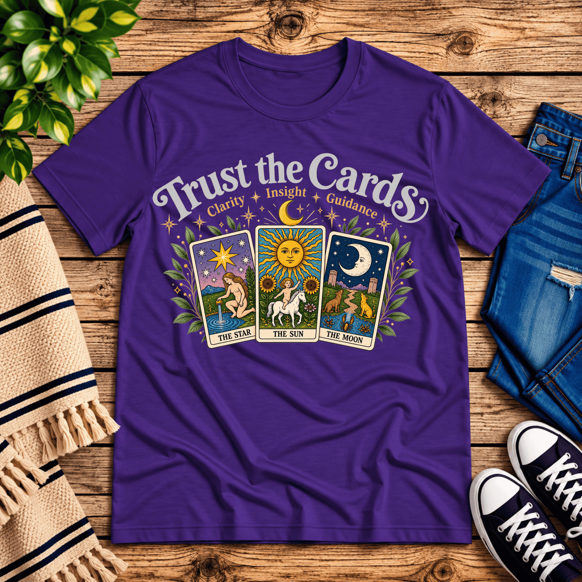 Trust the Cards mystical tarot graphic t-shirt cozy flat lay in team purple.