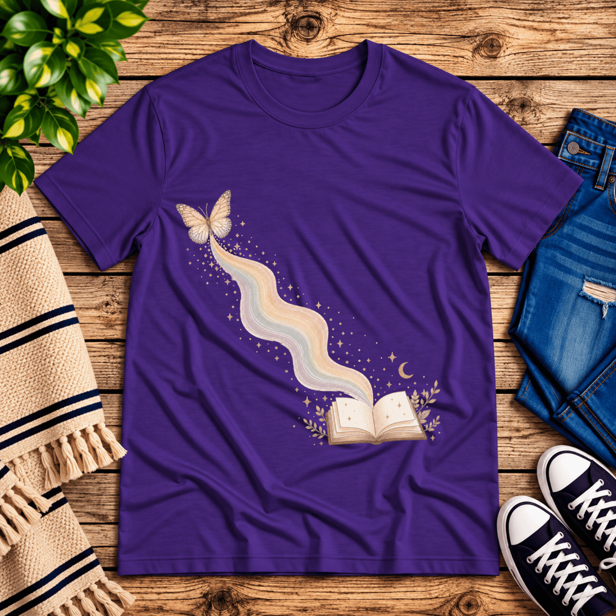 Rainbow Book whimsical book graphic t-shirt cozy flat lay in team purple.