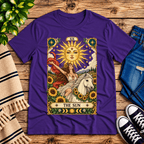 The Sun tarot card mystical graphic t-shirt cozy flat lay in team purple.
