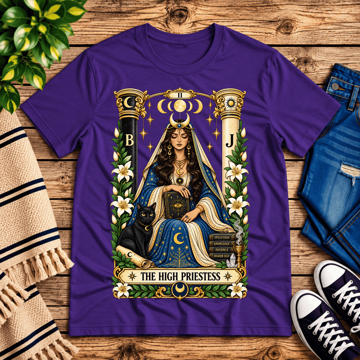 The High Priestess tarot card graphic t-shirt cozy flat lay in team purple.