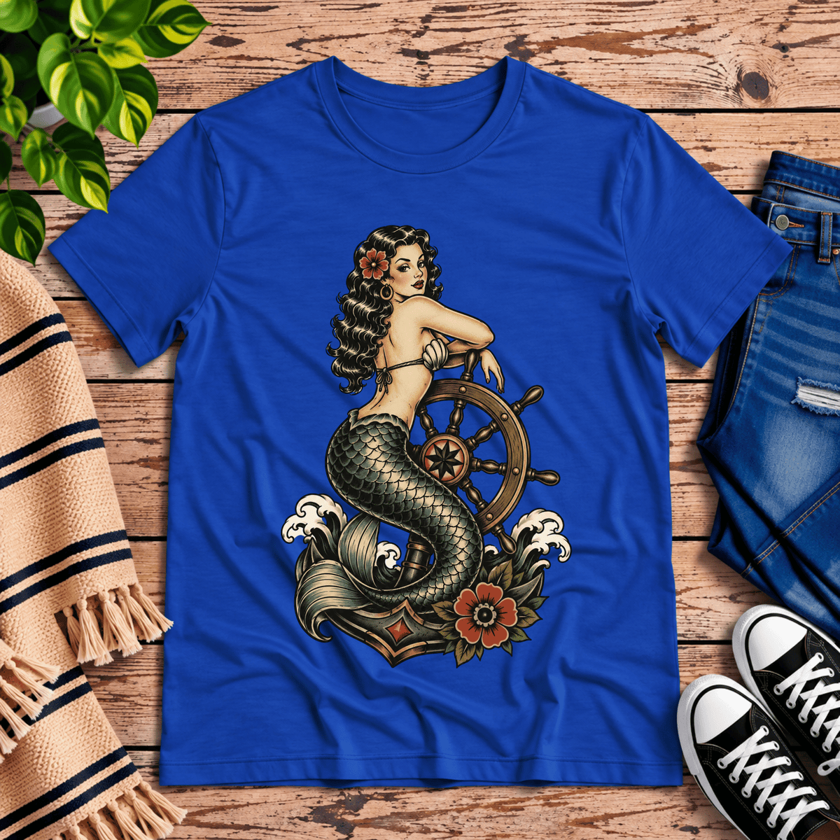 Ship Wheel Mermaid vintage pinup graphic t-shirt cozy flat lay in true royal.