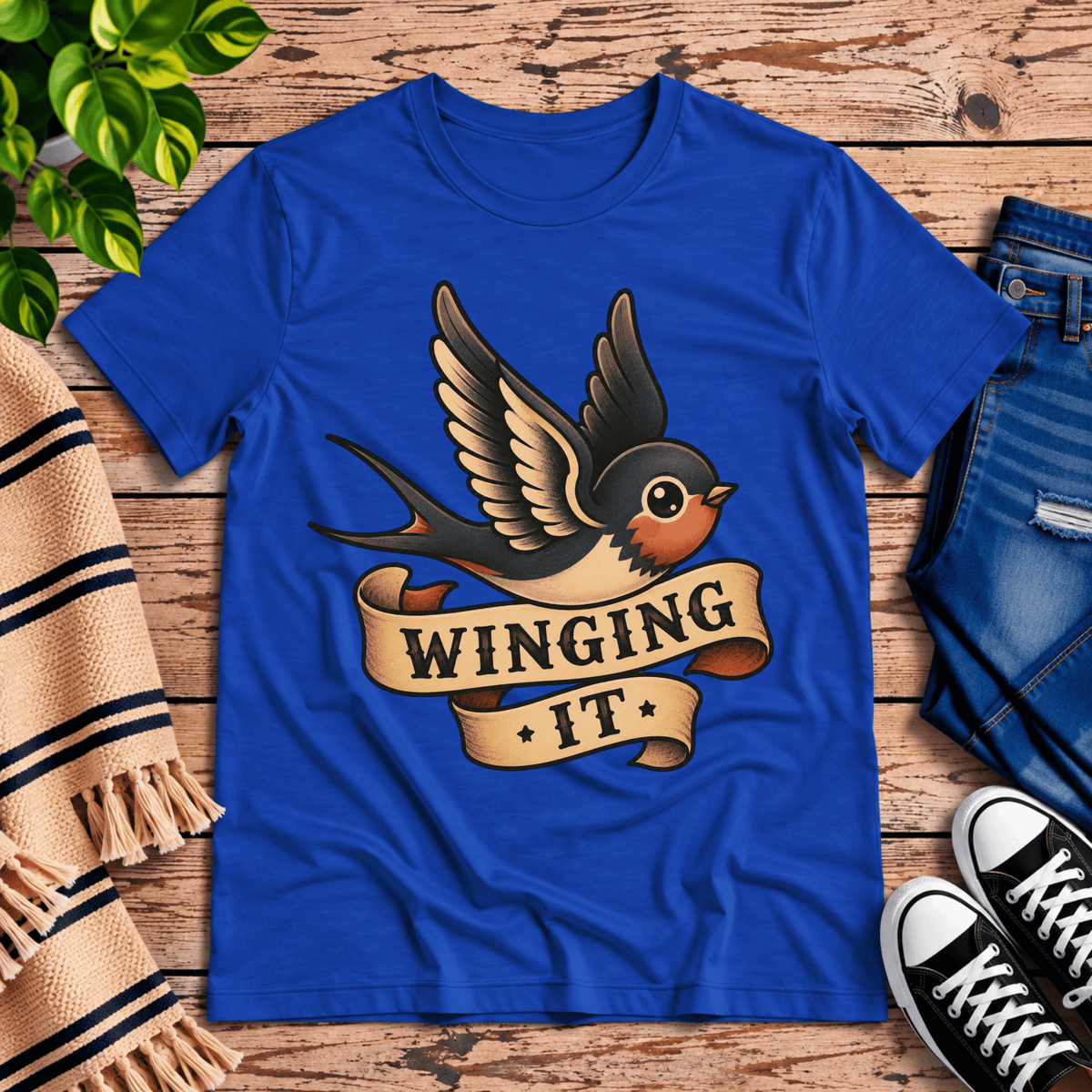 Winging It cute animal graphic t-shirt cozy flat lay in true royal.