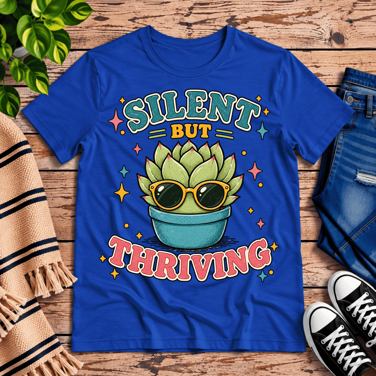 Silent But Thriving cute plant graphic t-shirt cozy flat lay in true royal.