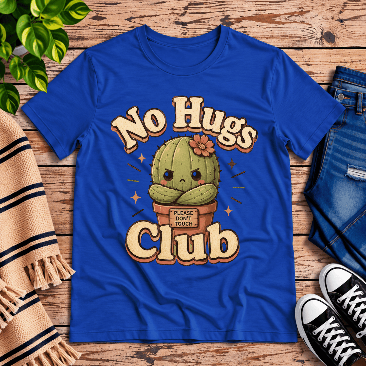 No Hugs Club funny cactus graphic t-shirt cozy flat lay in true royal.