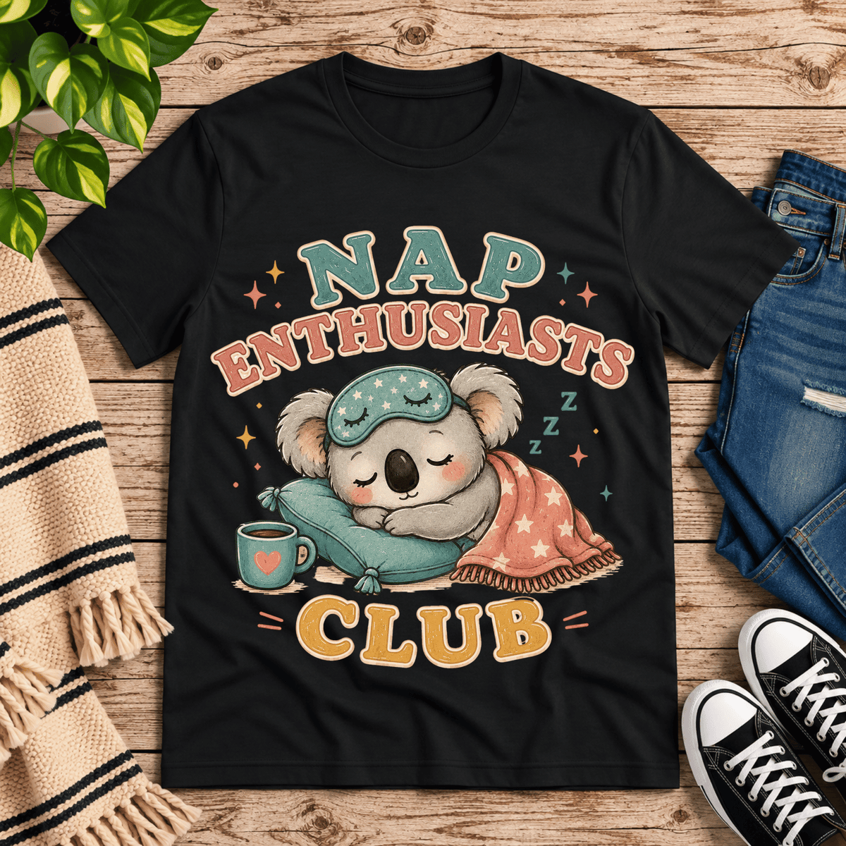 Nap Enthusiasts Club cute animal graphic t-shirt cozy flat lay in vintage black.