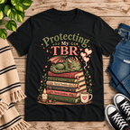 Protecting My TBR cute book graphic t-shirt cozy flat lay in vintage black.