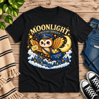 Moonlight Delivery cute animal graphic t-shirt cozy flat lay in vintage black.