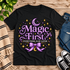 Magic First cute celestial graphic t-shirt cozy flat lay in vintage black.