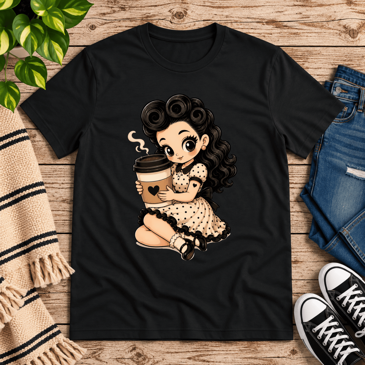 Coffee Clara pinup graphic t-shirt cozy flat lay in vintage black.